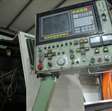 Draaibank Okuma LC20 CNC met spaanafvoerband 3